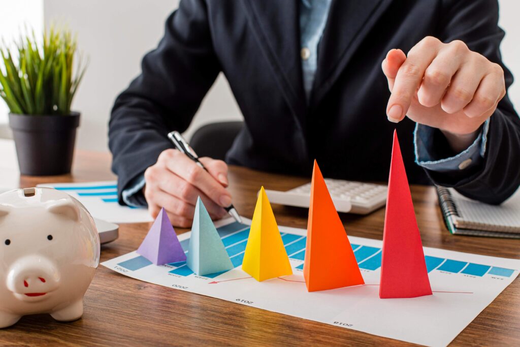 front view businessman with colorful cones representing growth 3
